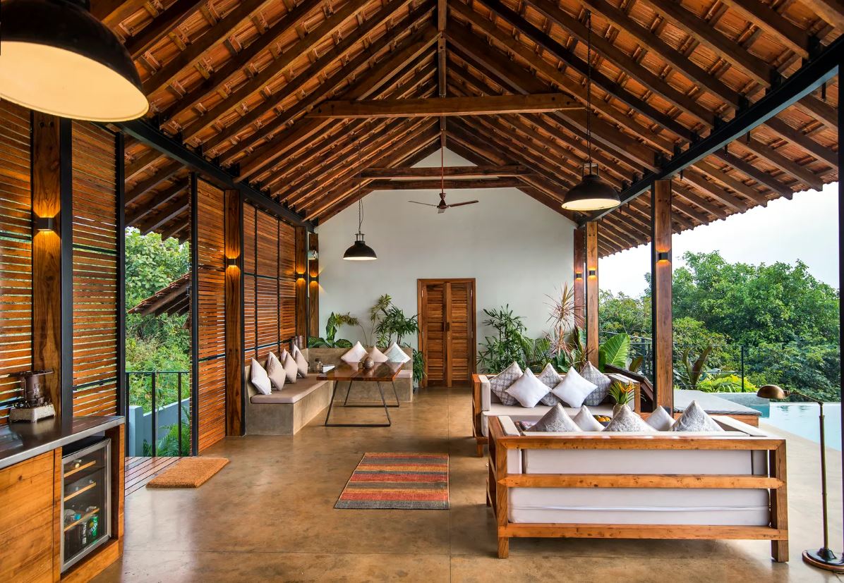 A semi open living area with pitched roof in the farmhouse design